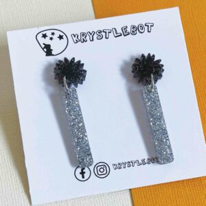 Black and silver glitter mini pop dangles with a star burst top