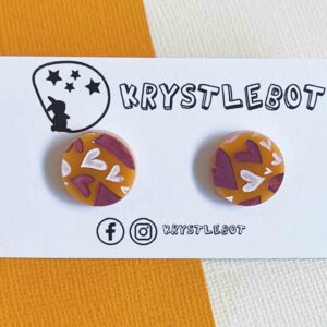 Orange circle statement studs with hand painted burgundy and white hearts