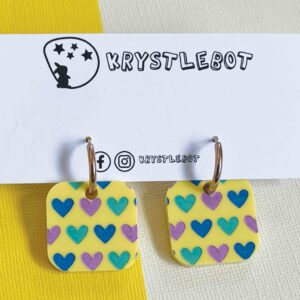 Yellow square painted dangles with a blue, purple and mint colour way and huggy hoop